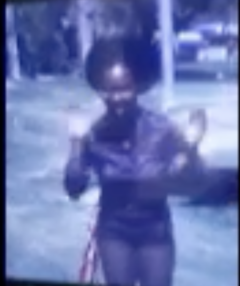A little girl dancing in the park, from an old home movie